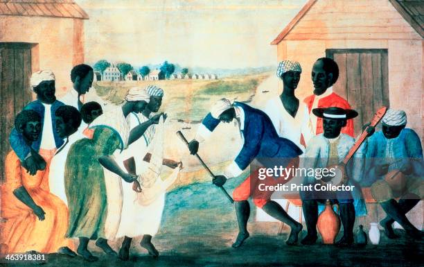 'The Old Plantation', 1800. Plantation slaves dancing in front of their wooden cabins accompanied by banjo and drum. From the collection of the...