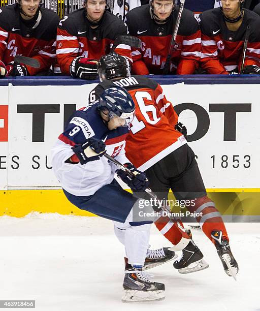 Forward Max Domi of Canada colides with forward Samuel Petras of Slovakia during the 2015 IIHF World Junior Championship on January 04, 2015 at the...