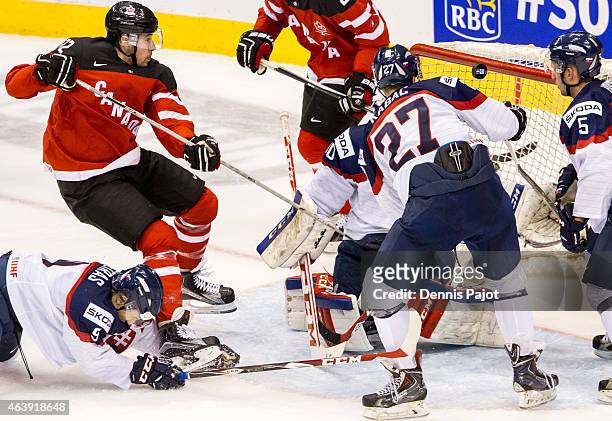 Forward Frederik Gauthier of Canada fires the puck past goaltender Denis Godla of Slovakia during the 2015 IIHF World Junior Championship on January...
