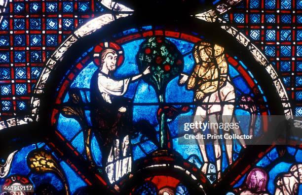 The Good Samaritan Window, Chartres Cathedral, France, 13th century. God warning Adam and Eve not to eat the fruit of the Tree of Knowledge.