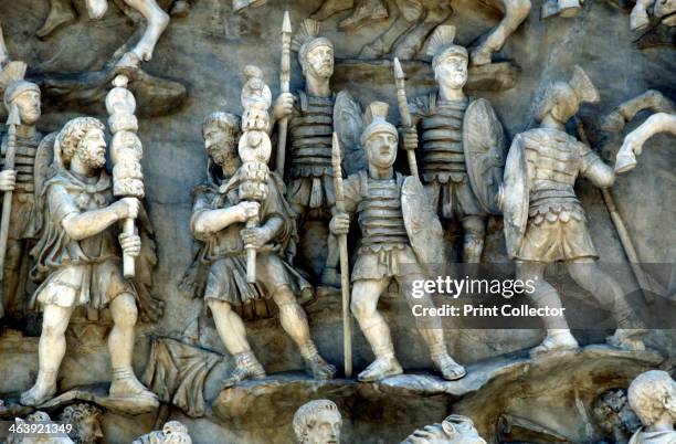 Roman soldiers taking part in decursio - ritual circling of funeral pyre, c180-196. Detail of a relief from the Antonine Column, Rome, erected...
