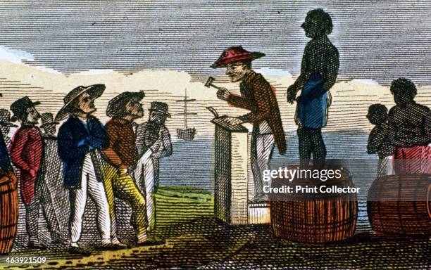 Auctioning slaves in the West Indies, 1824. After their transportation in chains from West Africa below decks in slave ships, the survivors were put...