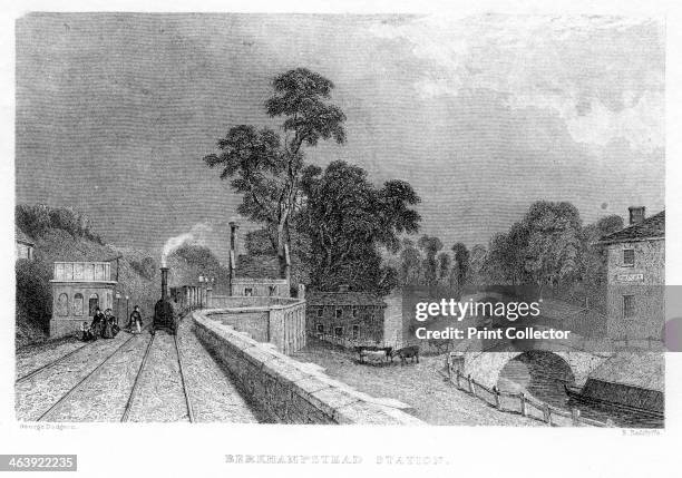 Berkhamsted Station, Hertfordshire, on the London and Birmingham Railway, c1860. On top of the building on the left is a water tank for supplying...