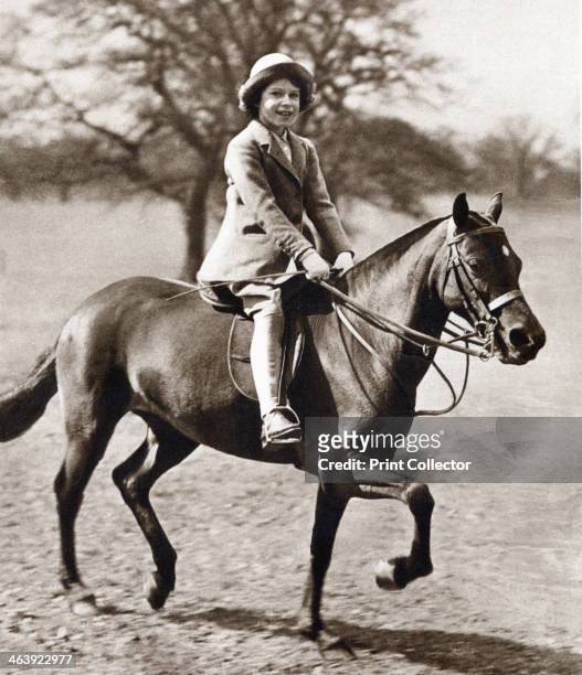Princess Elizabeth riding her pony in Winsor Great Park, 1930s. The future Queen Elizabeth II of Great Britain as a child.