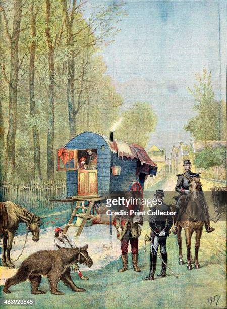 Gendarmes taking census forms to an encampment of itinerant gipsies in their caravan, 1895. A boy in the foreground leads a muzzled 'dancing' bear....