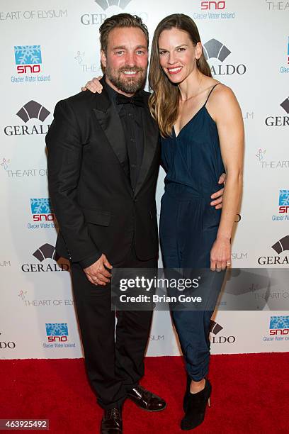 Brian Bowen Smith and Hilary Swank attend Geraldo Jewelry presents "Icons Of The Awards" Benefiting The Art Of Elysium at Mr. C Beverly Hills on...