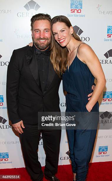 Brian Bowen Smith and Hilary Swank attend Geraldo Jewelry presents "Icons Of The Awards" Benefiting The Art Of Elysium at Mr. C Beverly Hills on...