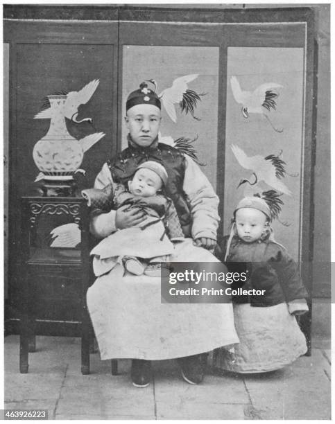 Henry P'u-i, c1910. Henry P'u-i the last emperor of China whose Imperial titles were Hsuan-Tung and K'ang-Te. He holds the hand of his father Prince...