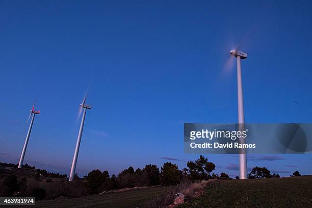 Wind turbines spin at an Acciona wind farm on February 17, 2015 near Igualada, Spain. France and Spain inaugurate the newly combined electrecity...