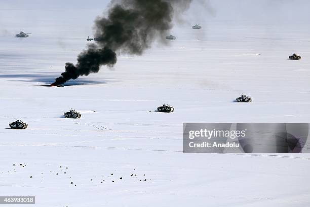 Smoke rises as the soldiers of 14th Mechanized infantry commandship of Turkish Armed Forces take part in Winter-2015 Field Exercise conducted by the...