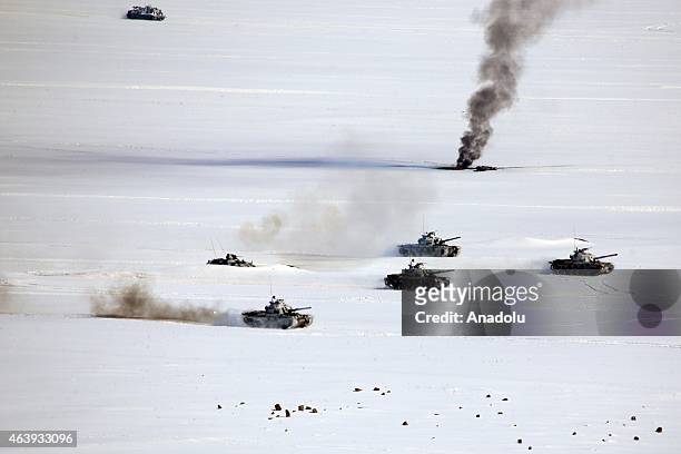 Smoke rises as the soldiers of 14th Mechanized infantry commandship of Turkish Armed Forces take part in Winter-2015 Field Exercise conducted by the...