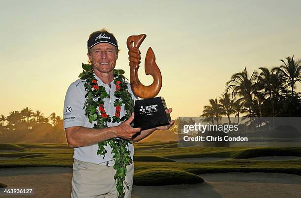 Bernhard Langer of Germany holds the tournament trophy after winning the Mitsubishi Electric Championship at Hualalai Golf Club on January 19, 2014...