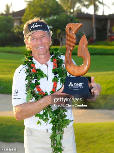 Bernhard Langer of Germany holds the tournament trophy after winning the Mitsubishi Electric Championship at Hualalai Golf Club on January 19, 2014...