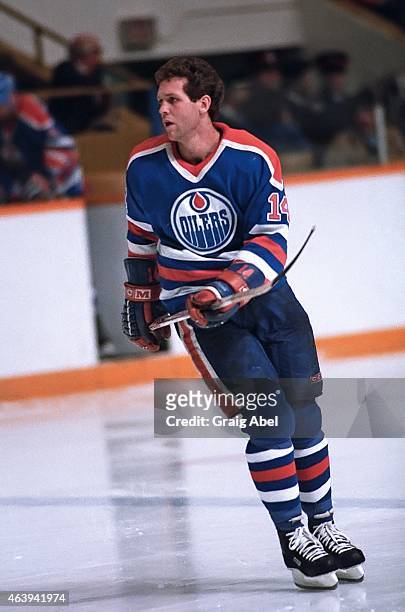 Craig MacTavish of the Edmonton Oilers watches the play against the Toronto Maple Leafs during NHL game action at Maple Leaf Gardens in Toronto,...