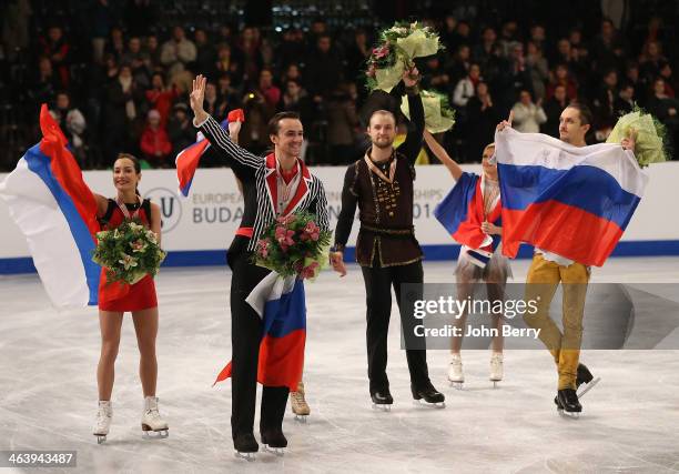 Tatiana Volosozhar and Maxim Trankov of Russia win the gold medal in front of silver medal Ksenia Stolbova and Fedor Klimov of Russia and Vera...