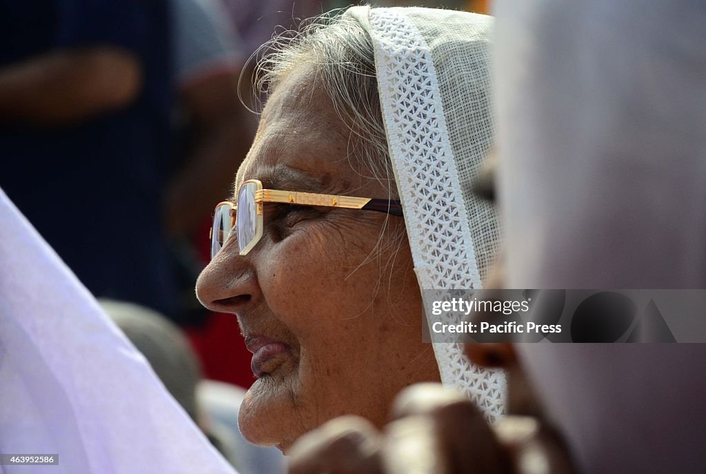 Widows of Varanasi celebrating Holi or the festival of...