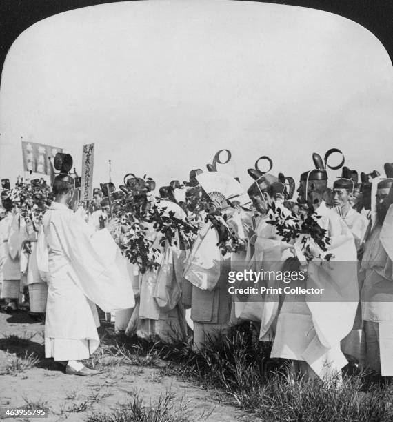 Shinto priests in a funeral procession for victims of the sinking of the 'Hitachi Maru', Tokyo, Japan, 1905. Detail from a stereoscopic card. The...