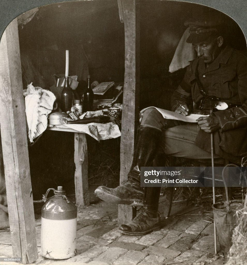 Staff officer in a dugout studying details before an offensive, World War I, 1914-1918Artist: Realistic Travels Publishers