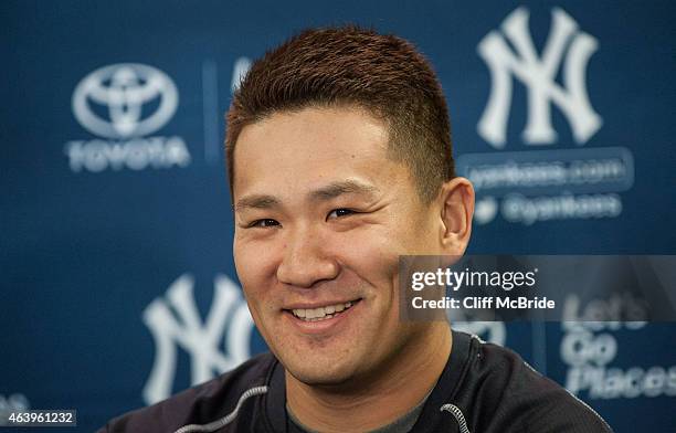 Pitcher Masahiro Tanaka of the New York Yankees talks with the media during spring training media availability at George M. Steinbrenner Field on...