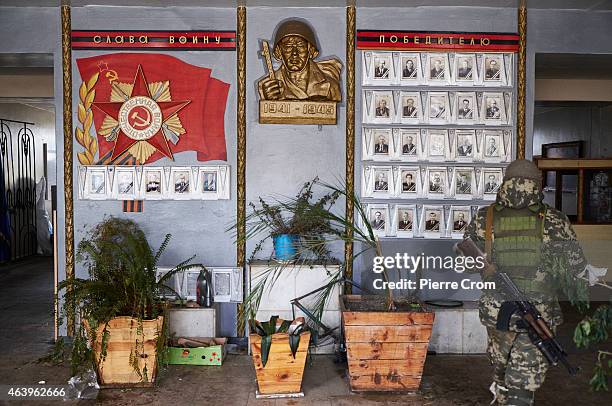 Pro-Russian fighter stands guard in the town's train station on February 20 , 2015 in Debaltseve, Ukraine. The strategic railway town of Debaltseve...