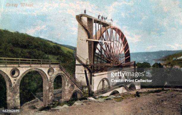 'Laxey Wheel, Isle of Man', 1904. The Laxey Wheel is a large waterwheel built in the town of Laxey in the Isle of Man. Designed by Robert Casement,...