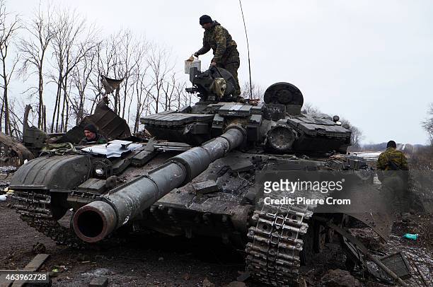 Pro-Russian rebel stands atop a Ukrainian tank on the outskirt of the town on February 20, 2015 in Debltseve, Ukraine. The strategic railway town of...