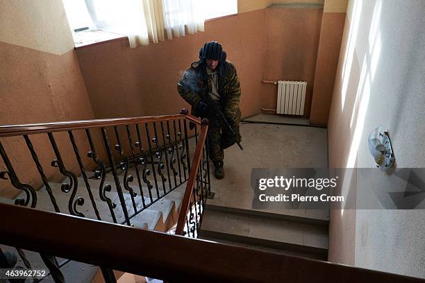 Pro-Russian fighter stands guard in the town's train station on February 20 , 2015 in Debaltseve, Ukraine. The strategic railway town of Debaltseve...