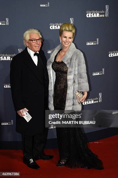 French photographer Jean-Daniel Lorieux and his wife Laura Restelli Brizard pose as they arrive for the 40th edition of the Cesar Awards ceremony on...