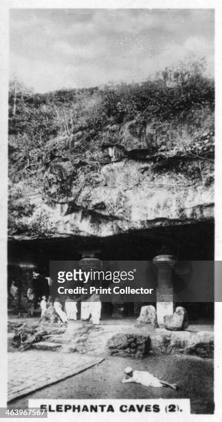 Elephanta Caves, Bombay, India, c1925. The 8th-century Hindu temple caves near Mumbai were carved out of the rock. Cigarette card produced by the...