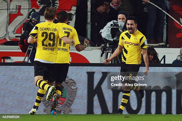 Ilkay Guendogan of Dortmund celebrates his team's second goal with team mates Pierre-Emerick Aubameyang and Marcel Schmelzer during the Bundesliga...