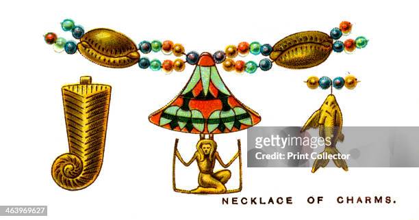 Necklace of Charms, 1923. Jewellery made from cowrie shells, ancient Egyptian pharaoh's beard and kneeling figure, and a fish. One of a series of WD...