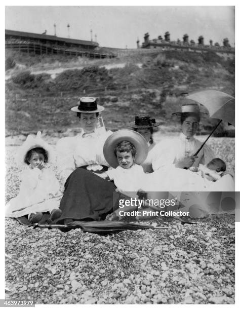 People on a beach, c1890-1909.