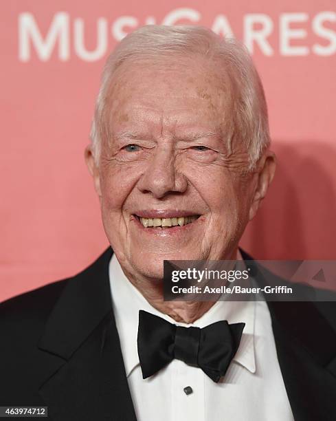Former President Jimmy Carter arrives at the 2015 MusiCares Person of The Year honoring Bob Dylan at Los Angeles Convention Center on February 6,...
