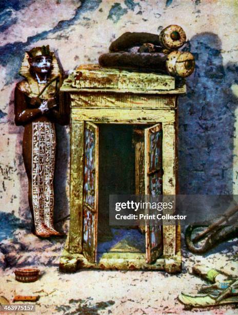 Golden shrine in the antechamber of Tutankhamun's tomb, Egypt, 1933-1934. Embossed with scenes representing incidents in the lives of the departed...
