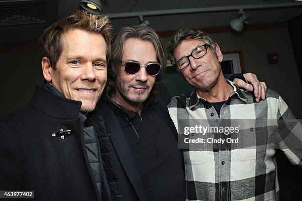 Actor/ musicians Kevin Bacon and Rick Springfield pose with original MTV VJ and SiriusXM host Mark Goodman during a visit to the SiriusXM Studios on...