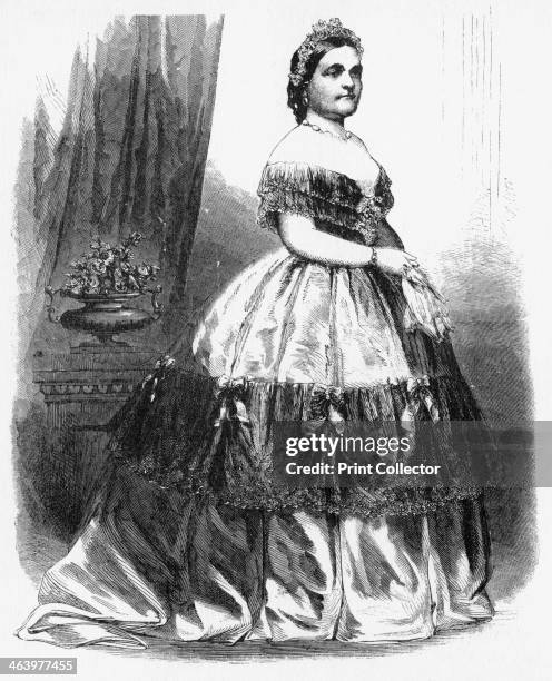 'Mrs Lincoln', c1860s. The wife of President Abraham Lincoln shows one of her gowns on a trip to New York. Illustration from Adventures of America,...