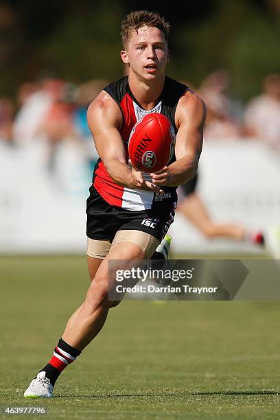 Jack Billings of the Saints handballs during the St Kilda Saints AFL intra club match at Linen House Oval on February 21, 2015 in Melbourne,...