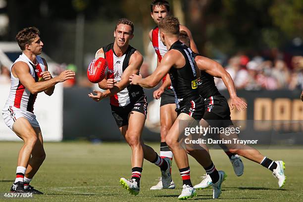 Luke Dunstan of the Saints handballs during the St Kilda Saints AFL intra club match at Linen House Oval on February 21, 2015 in Melbourne, Australia.