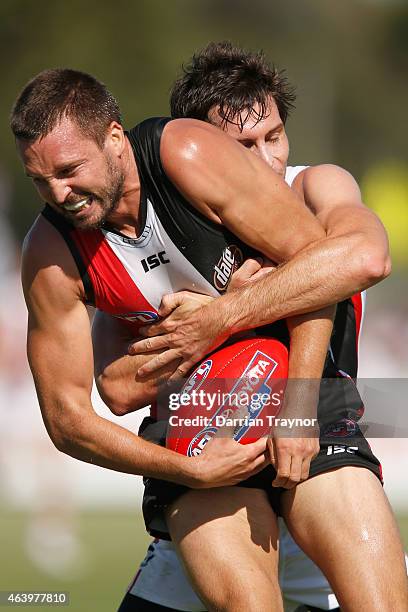 Jarryn Geary is tackled by Farren Ray of the Saints during the St Kilda Saints AFL intra club match at Linen House Oval on February 21, 2015 in...