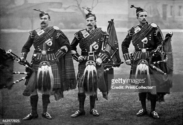 Pipers of the 1st Scots Guards, 1896. Pipe-Major Fraser flanked by Piper James Pourie and Piper John Gordon . A print from The Navy and Army...