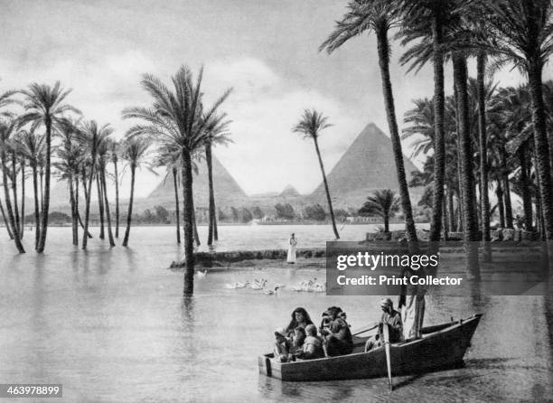 The Pyramids of Giza during a flood, Cairo, Egypt, c1920s. Plate taken From In the Land of the Pharaohs, published by Lehnert & Landrock .