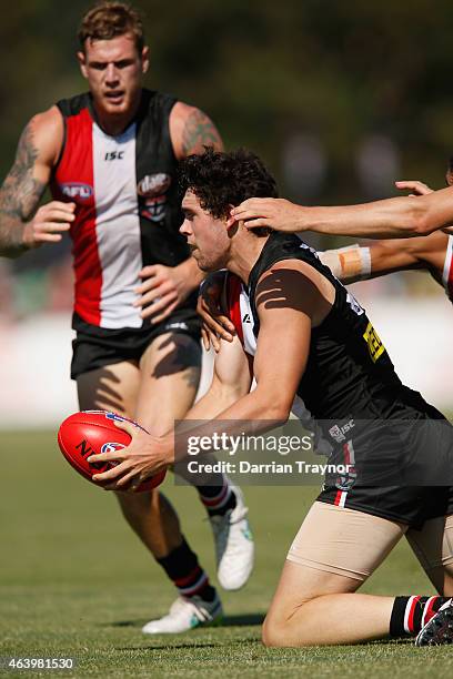 Number 1 draft pick Paddy McCartin looks to handball during the St Kilda Saints AFL intra club match at Linen House Oval on February 21, 2015 in...