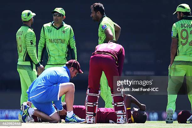 Darren Bravo of the West Indies lies on the ground after injuring himself during the 2015 ICC Cricket World Cup match between Pakistan and the West...