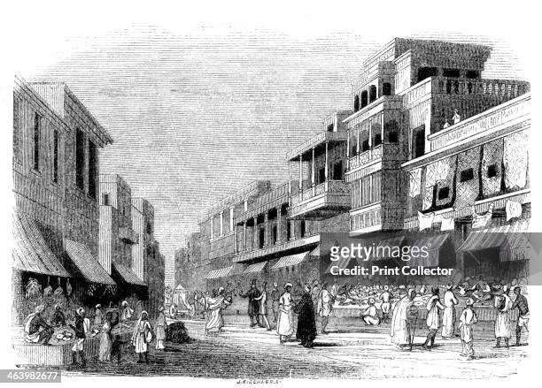 'Bazaar in Bombay, India', 1847. Market in Mumbai, with canopied balconies above. Illustration from The History of China and India, by Miss Corner, .