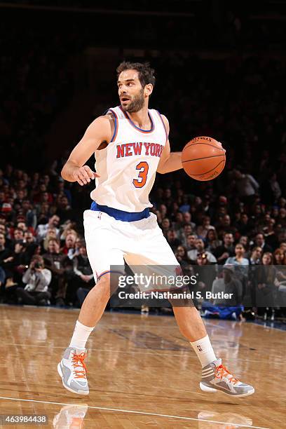 Jose Calderon of the New York Knicks handles the ball against the Miami Heat on February 20, 2015 at Madison Square Garden in New York City. NOTE TO...