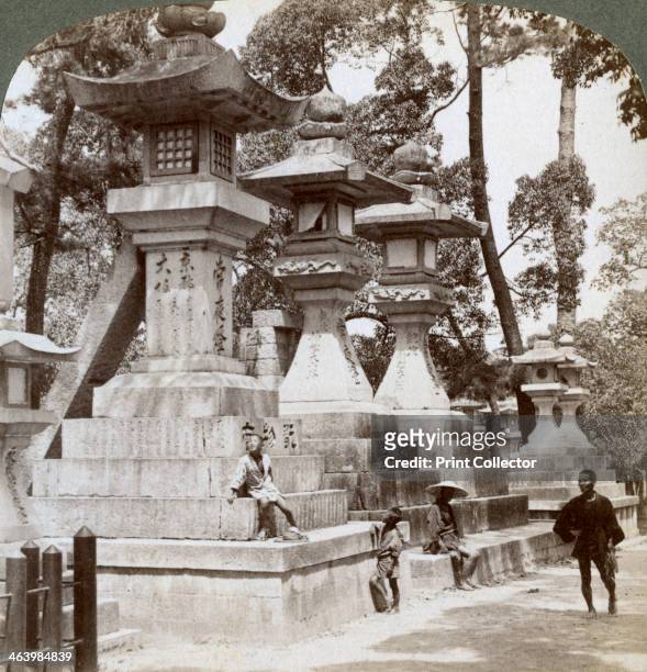 Stone lanterns at Sumiyoshi, Osaka, Japan, 1904. Sumiyoshi is the site of one of the oldest Shinto shrines in Japan, believed to have been built in...