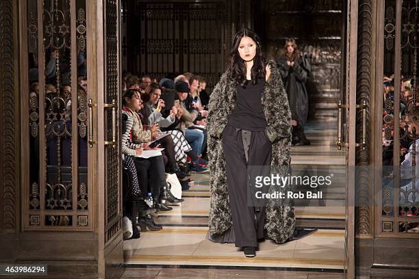 Model walks the runway at the merit award winning James Kelly show during London Fashion Week Fall/Winter 2015/16 at Fashion Scout Venue on February...