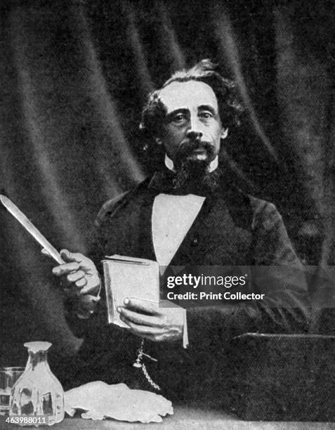 Charles Dickens giving a reading, 1859 . A print from The Bookman, February 1912.