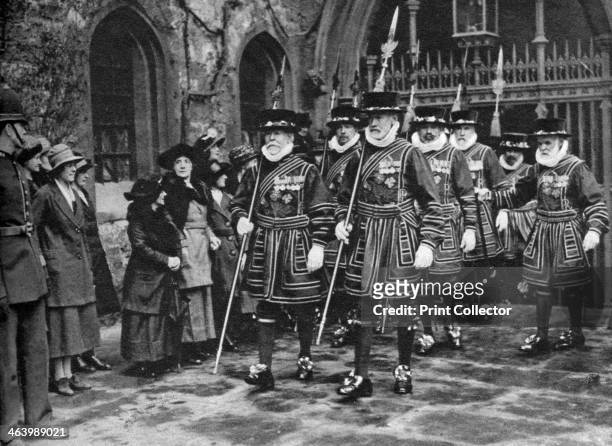 Distribution of the Maundy Money by Yeomen Warders, Thursday before Easter, Tower of London, 1926-1927. 'Beefeaters' carrying out an ancient custom....
