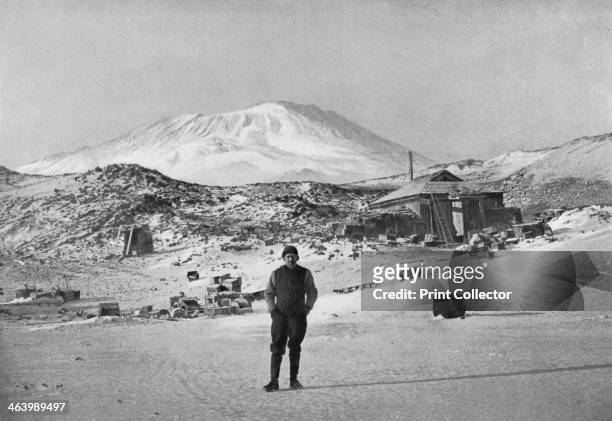 British explorer Ernest Shackleton at the Cape Royds base camp, Antarctica, 1908. Mount Erebus in the background. Shackleton during his expedition of...